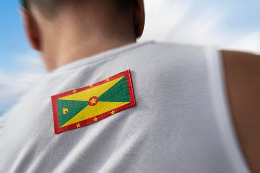 The national flag of Grenada on the athlete's back