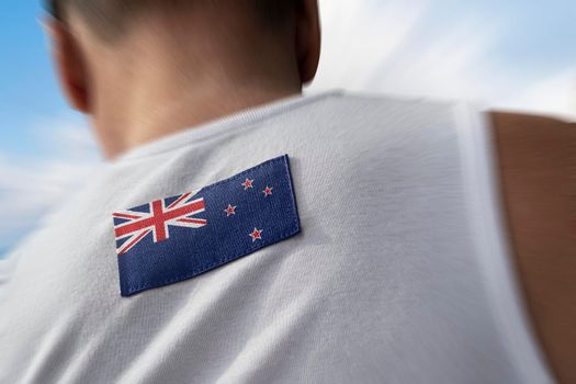 The national flag of New Zealand on the athlete's back