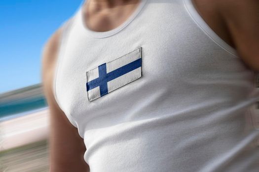 The national flag of Finland on the athlete's chest