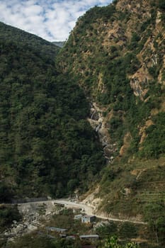 High waterfall flowinng in the nepalese mountains