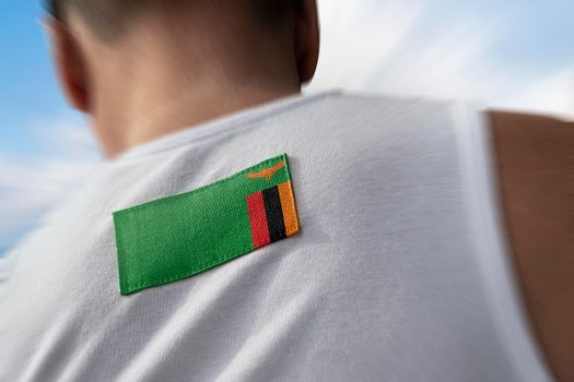 The national flag of Zambia on the athlete's back