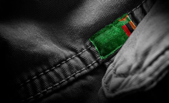 Tag on dark clothing in the form of the flag of the Zambia