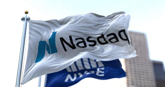 New York, USA, April 14 2021: Flags of NASDAQ and NYSE flying in the wind.