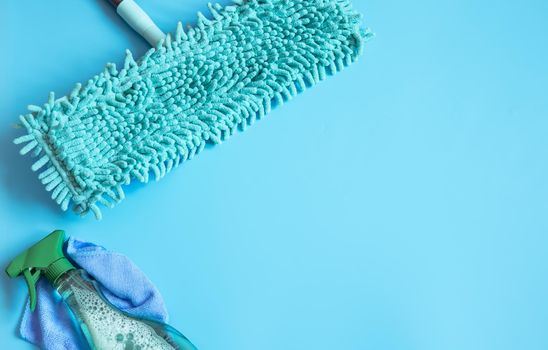 Minimalistic composition with mop and detergent for cleaning and keeping clean copy space.