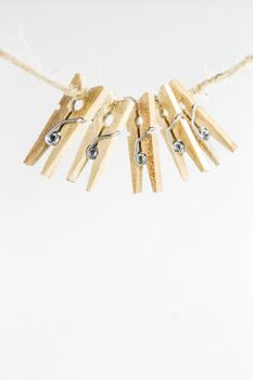 small decorative clothespins on a white background
