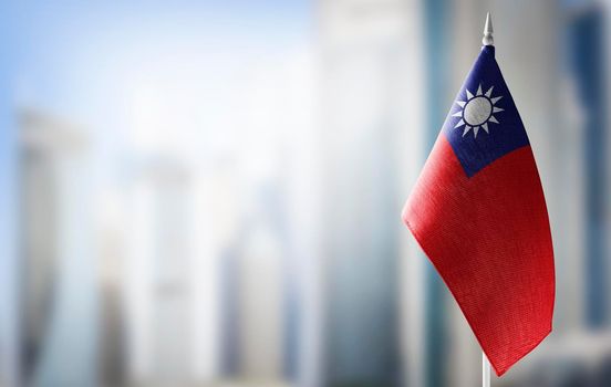 A small flag of Taiwan on the background of a blurred background