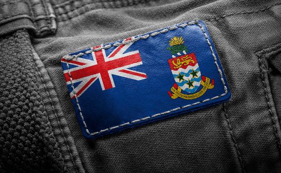 Tag on dark clothing in the form of the flag of the Cayman Islands