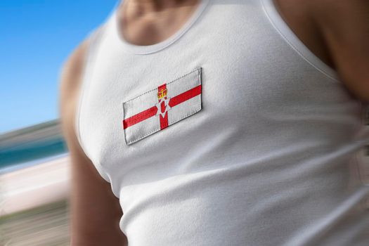 The national flag of Northern Ireland on the athlete's chest