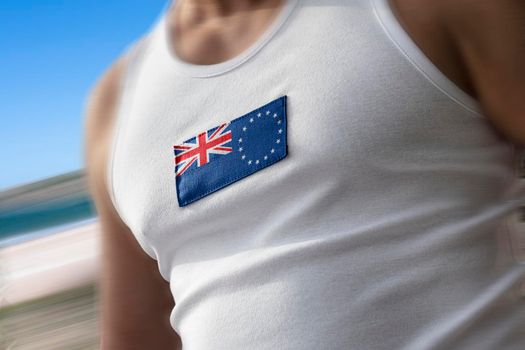 The national flag of Cook Islands on the athlete's chest.