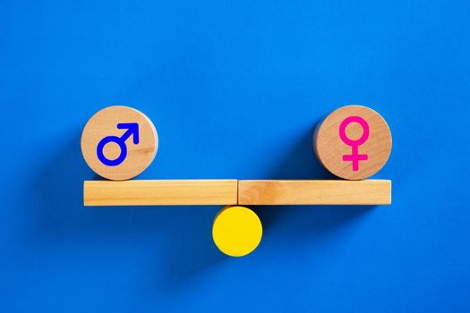 Gender Equality Concept. Male And Female Symbol Balancing On Seesaw