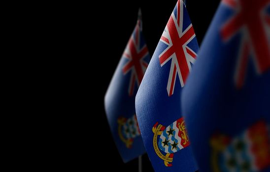 Small national flags of the Cayman Islands on a black background