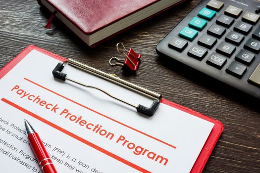 Paycheck Protection Program PPP loan application form and pen.