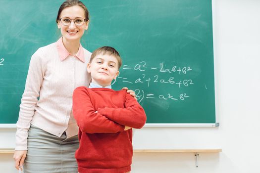 Brilliant schoolboy is proud of his work and so is the teacher