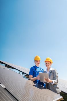 Manager and worker in photovoltaic power plant