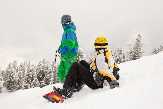 Skier and Snowboarder on mountain