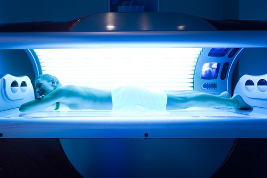 Woman on tanning bed