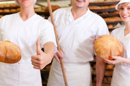 Baker with his team in bakery