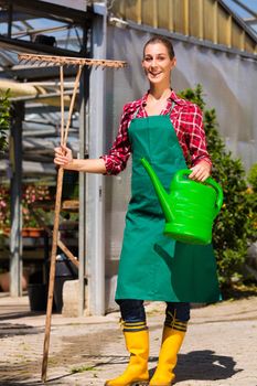Woman commercial gardener in nursery