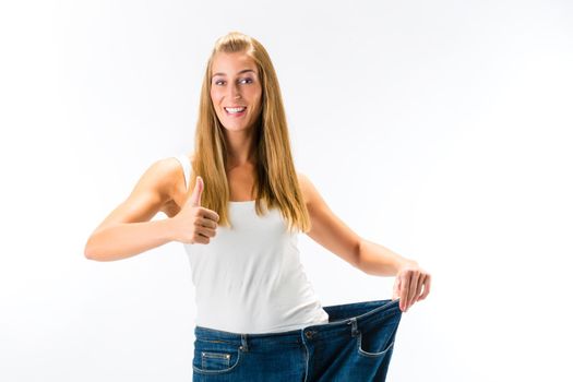 woman on diet with oversized pants