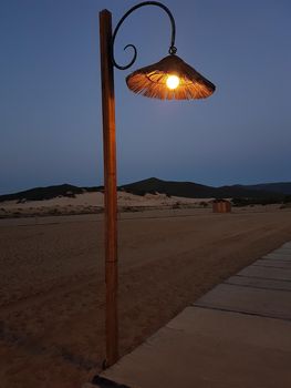 a lamp post on the beach avenue