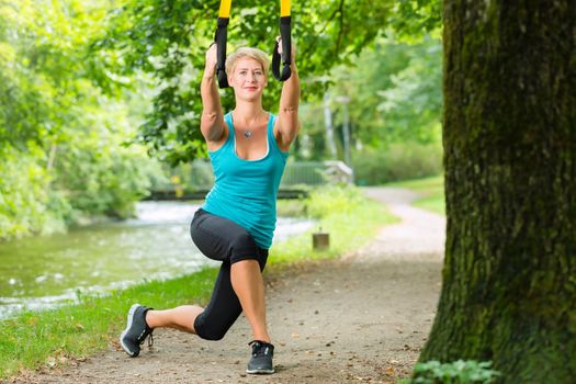 woman doing suspension sling trainer sport