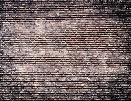 Aged and weathered old brick wall texture in a retro vintage design 
