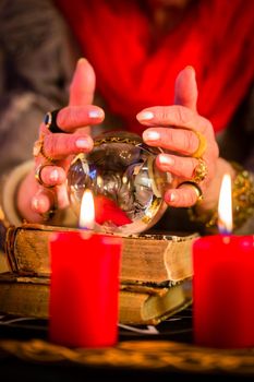 Soothsayer during esoteric session with Crystal ball