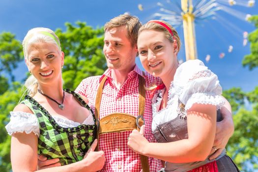 Friends visiting Bavarian folk festival