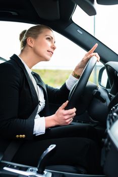 Woman in car being angry cursing other driver