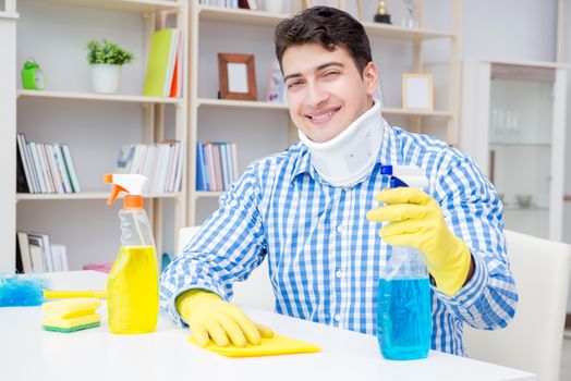Man with neck unjury cleaning house in housekeeping concept