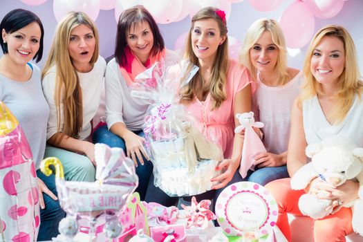 Expecting Mother with presents on baby shower party