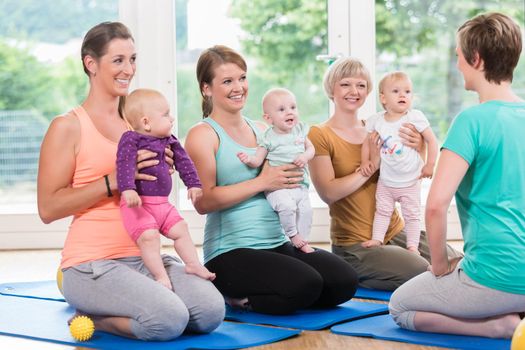 Women and their babies in mother-child gymnastic course