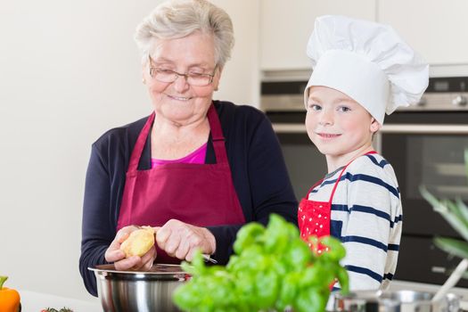 Grandma and grandson cooking together