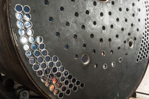 Close-up of the surface of a metallic industrial boiler