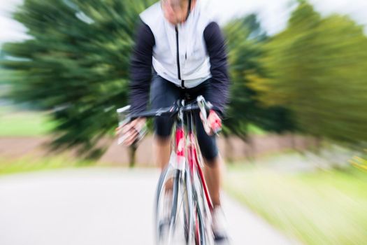 Fast Sport Bicyclist on bike with motion blur