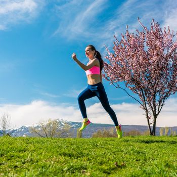Woman sport running on hill for fitness in spring