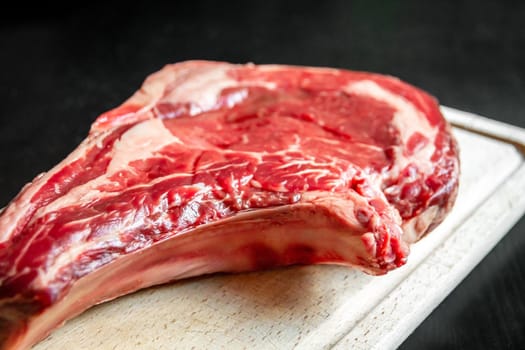 Beef prime rib on a cutting board