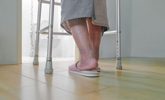 Elderly swollen feet or edema leg walk into bathroom