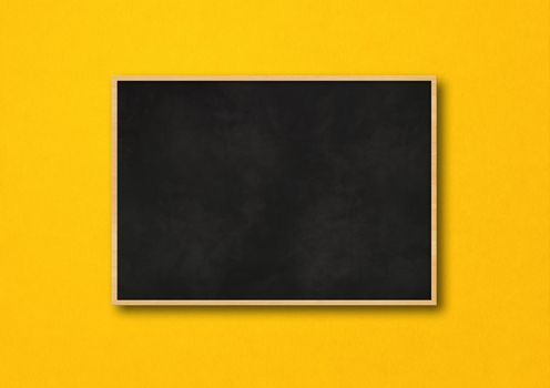 Traditional black board isolated on a yellow background