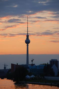Silhouette at sunset of the Fernsehturm (Television Tower)