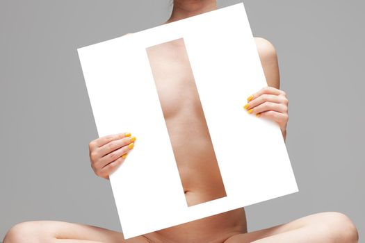 nude girl holding stencil letter i