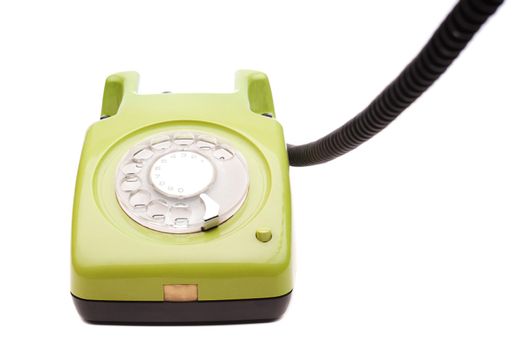 Green telephone retro style on white background. Vintage phone handset receiver