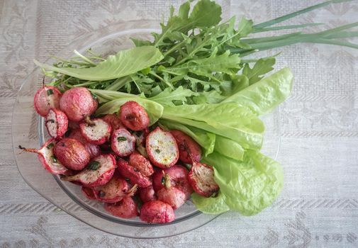 Baked radish with green onions and salad.