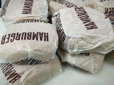 Beef hamburger in paper wrap