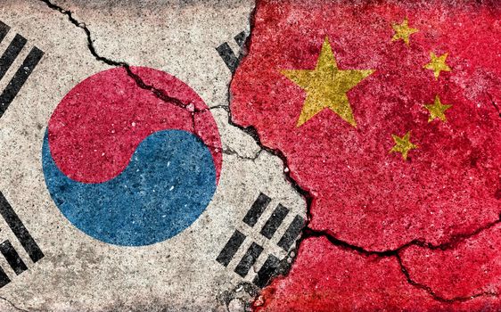 Grunge country flag illustration (cracked concrete background) / China vs South korea (Political or economic conflict)