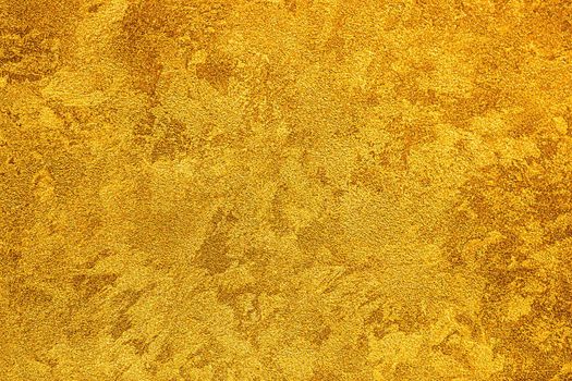 Texture of golden decorative plaster or concrete. Abstract grunge background.