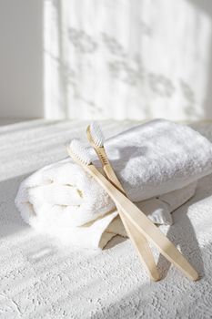 Bamboo brushes and towels . Light and shadows. Spa treatments. Concern for the environment . Bath treatments. Article about the spa .