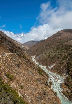 Lhotse summit, trail and river in the Himalayas