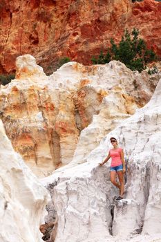 Tourist exploring the red and white cliffs of Ben Boyd in Australia