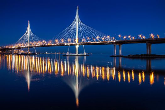 Cable-stayed bridge ZSD at night. Modern high bridge over the river. Night landscape of the city of Saint Petersburg. Sights Of Saint Petersburg. Night city. Road bridge